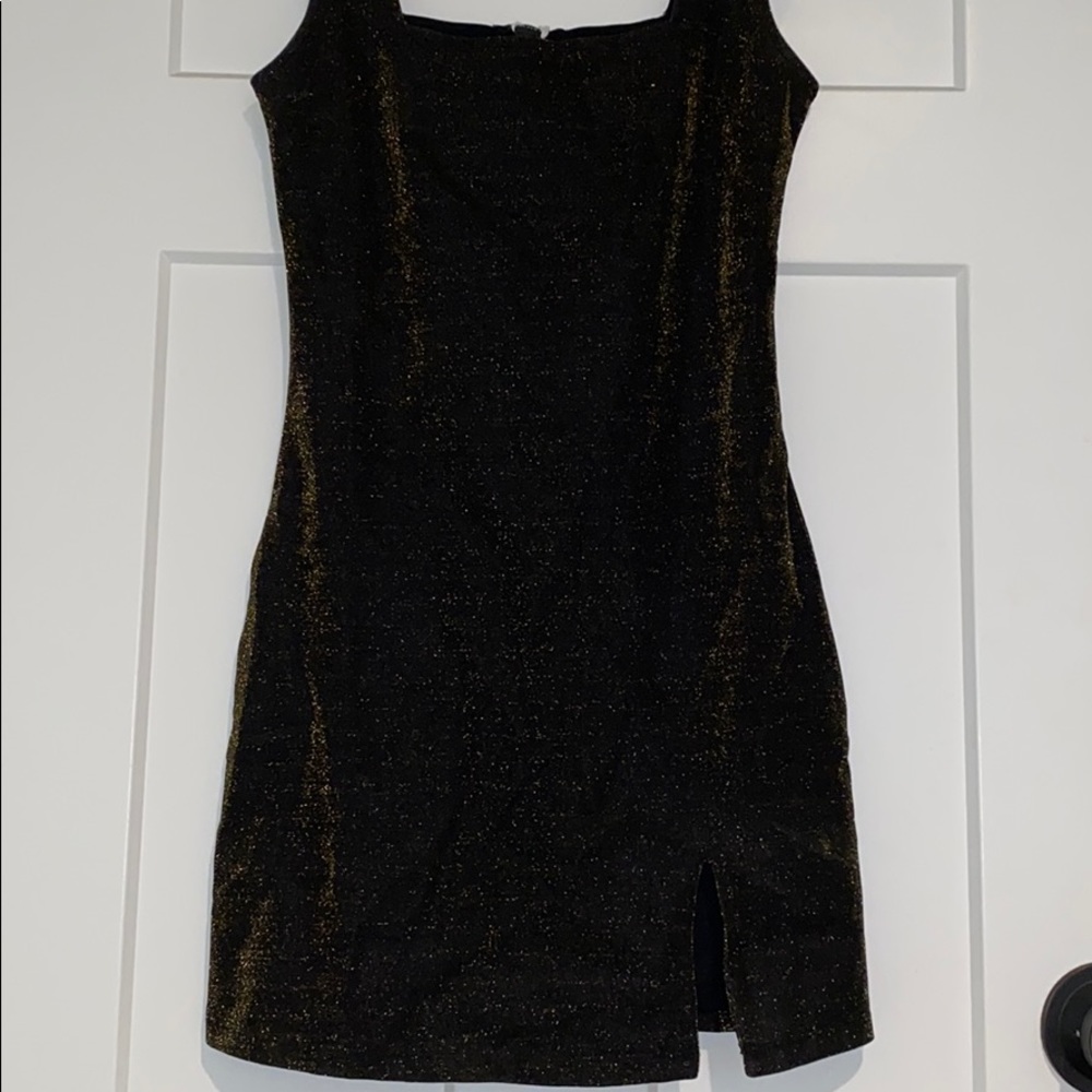 Tight fitting black with gold glitter dress